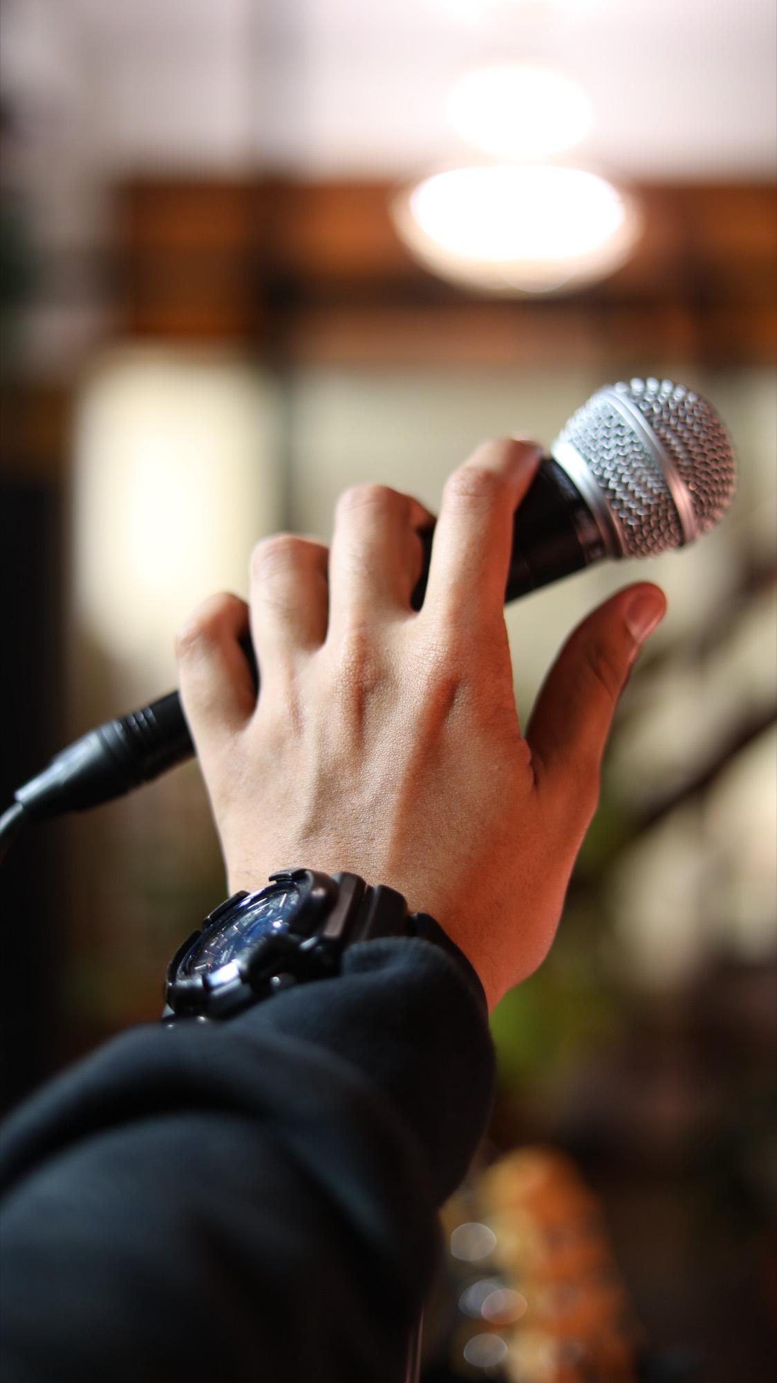 A vocalist holding a microphone